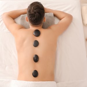 Handsome,Man,Having,Stone,Massage,In,Spa,Salon
