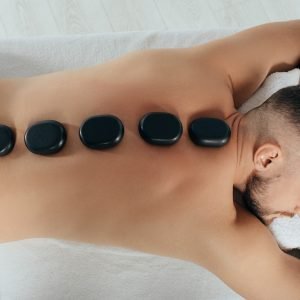 Relaxing,Hot,Stone,Massage.,View,From,Above,Handsome,Man,With