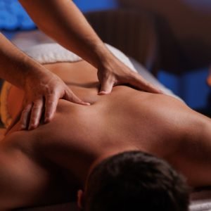 Physiotherapist,Massaging,Male,Patient,With,Damaged,Shoulder,Muscle,,Treating,Sports